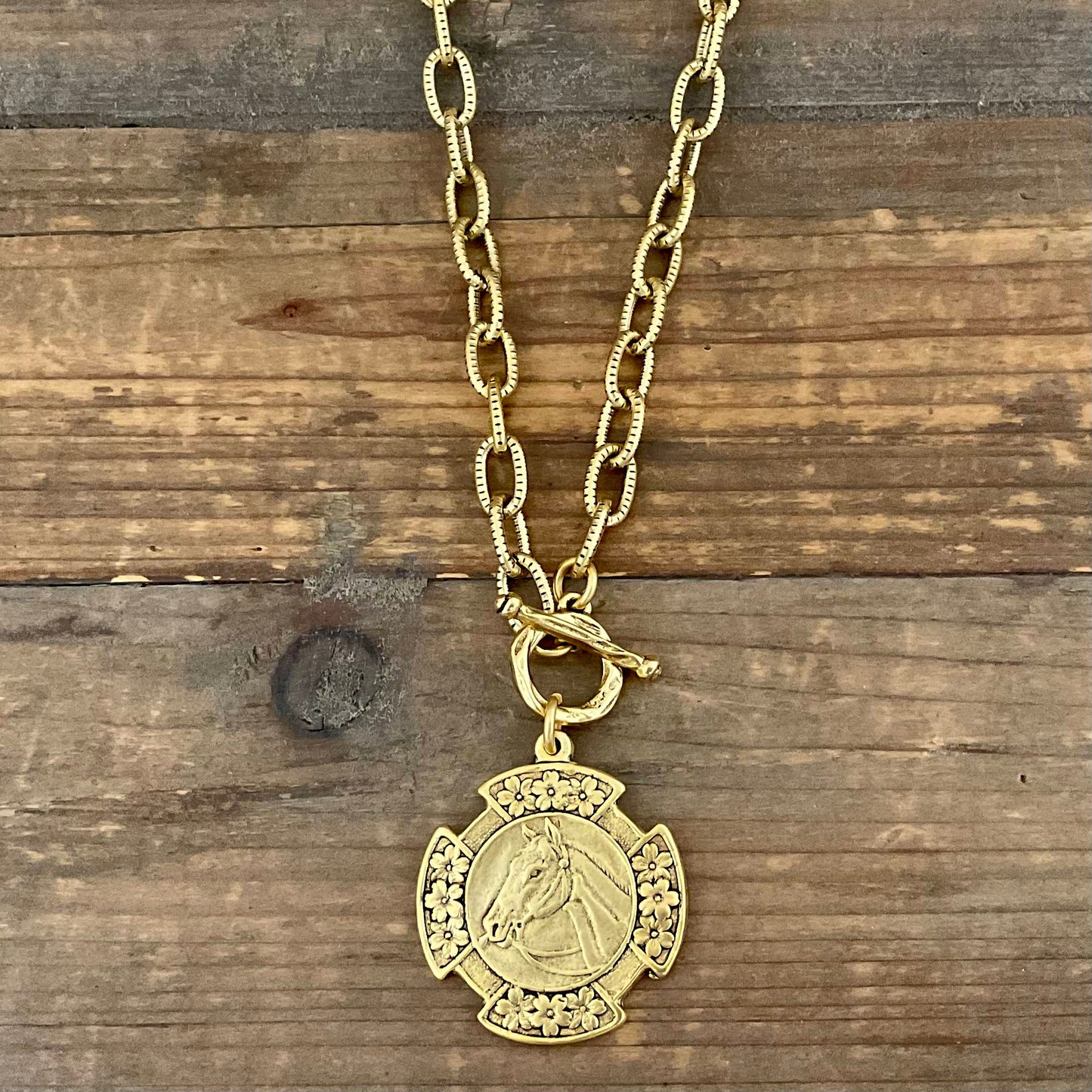 Vintage Gold 18" Chain And Toggle With Reproduction Gold Horse Flower Pendant, side view