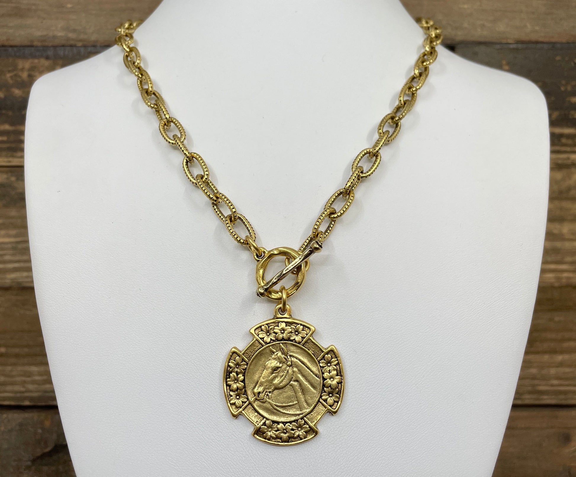 Vintage Gold 18" Chain And Toggle With Reproduction Gold Horse Flower Pendant, detail view